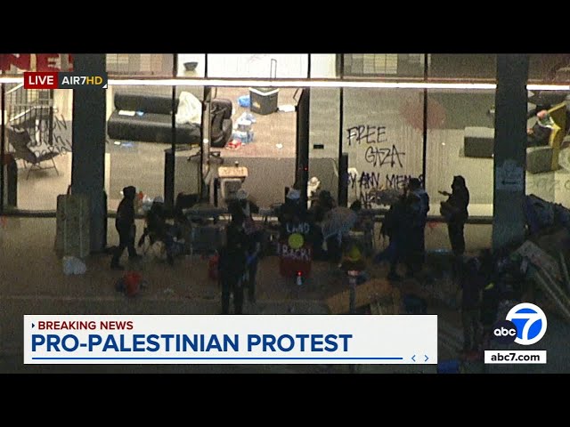 ⁣Pro-Palestinian protesters at Cal State LA barricade president's office building