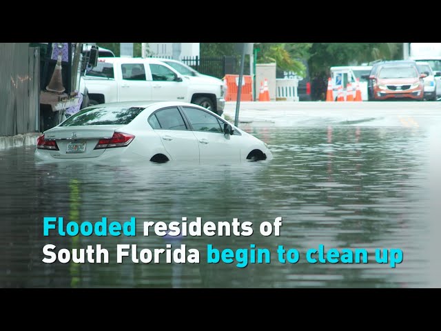 ⁣Flooded residents of South Florida begin to clean up
