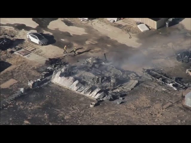 ⁣Lancaster brush fire destroys home