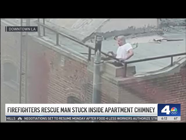 ⁣Firefighters rescue man stuck in downtown LA building's chimney
