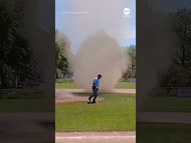 ⁣Towering dust devil interrupts baseball game in Buffalo suburb