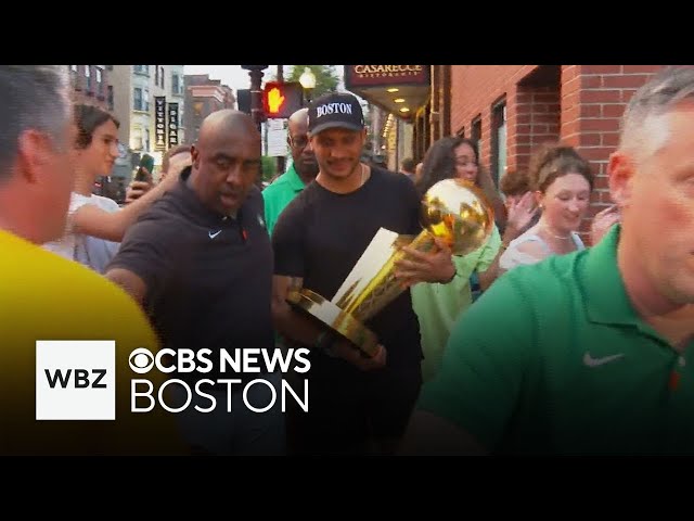 ⁣Celtics coach takes NBA championship trophy on tour of the North End