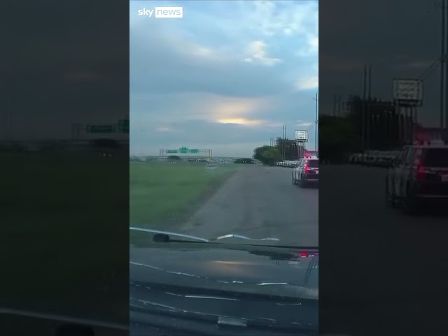 ⁣Suspect leans out of moving car and shoots at police