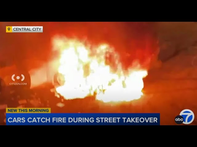 ⁣Multiple vehicles are set on fire during street takeover at downtown LA intersection