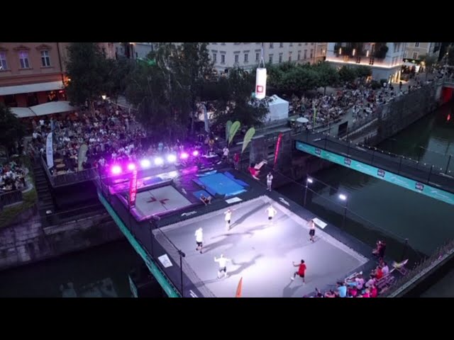 ⁣Acrobats attempt trampoline world record jump over river