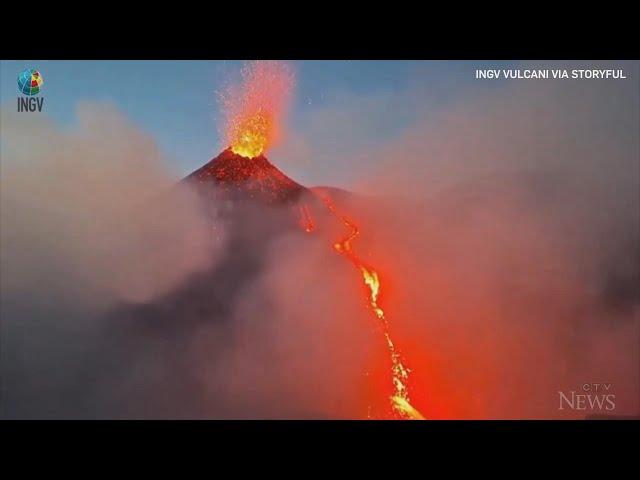 ⁣Vibrant cascade of lava spews from Italy's Mount Etna