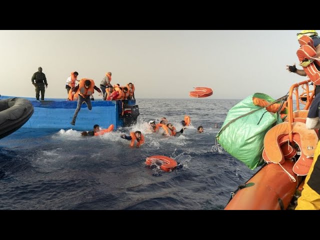 ⁣Migrants jump into sea as armed bandits climb onboard their boat during rescue mission