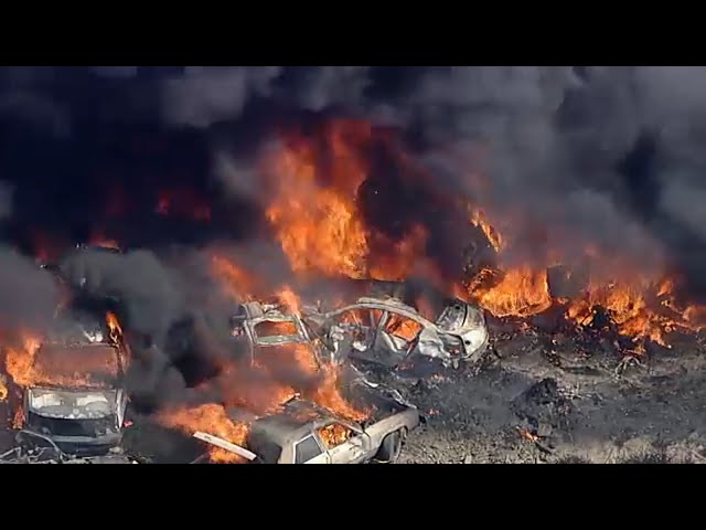 ⁣Hundreds of cars on fire at Lancaster salvage yard