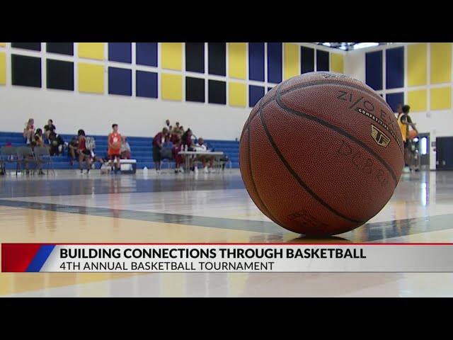 ⁣Denver police officers connect with local youth with annual basketball tournament