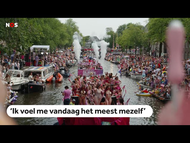 ⁣Feestende mensen en volle kades tijdens Canal Parade