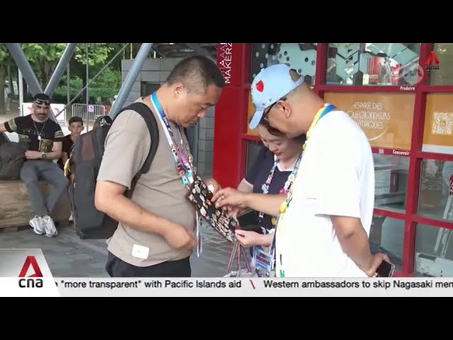 Athletes, fans join in on Olympic pin trading craze in Paris