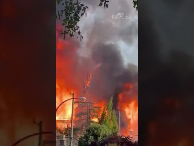 ⁣Video shows crane collapsing at massive fire in Vancouver