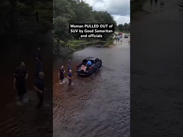 ⁣Florida woman PULLED OUT of SUV after being trapped in floodwaters from Hurricane Debby