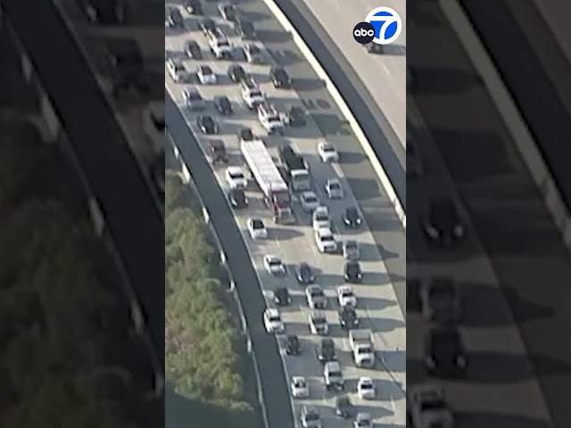 ⁣YIKES! Hundreds of boxes spill onto SoCal freeway after messy crash