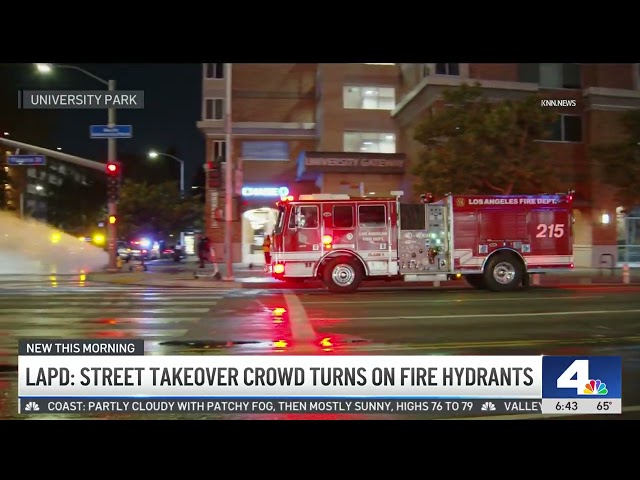 ⁣LAPD street takeover crowd turns on fire hydrants