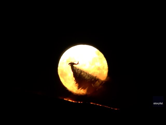 ⁣Watch the supermoon rise behind California's Quimby fire | USA TODAY