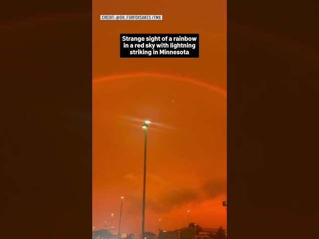 ⁣Strange sight of a rainbow in a red sky with lightning striking in Minnesota