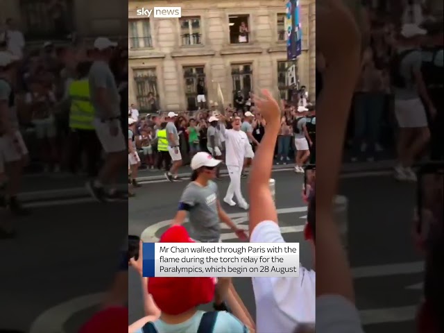 ⁣Jackie Chan carries Paralympic torch