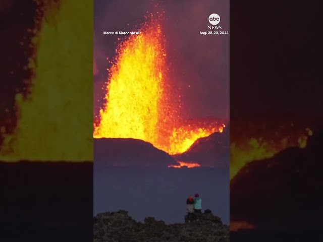 ⁣Northern Lights and erupting volcano light up the sky in Iceland