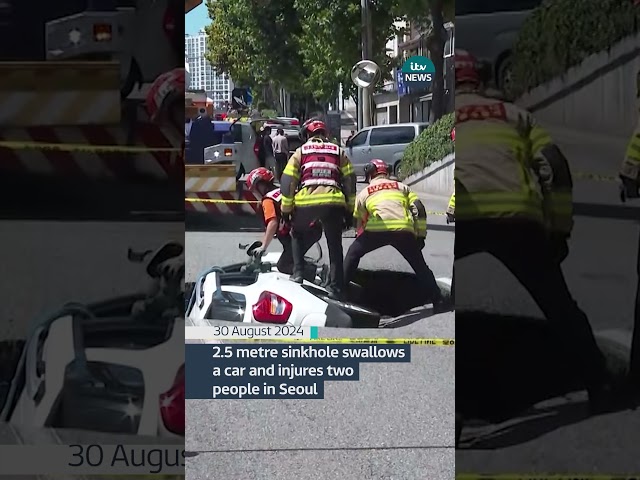 ⁣2.5 metre sinkhole swallows a car and injures two people in Seoul #itvnews #news #sinkhole