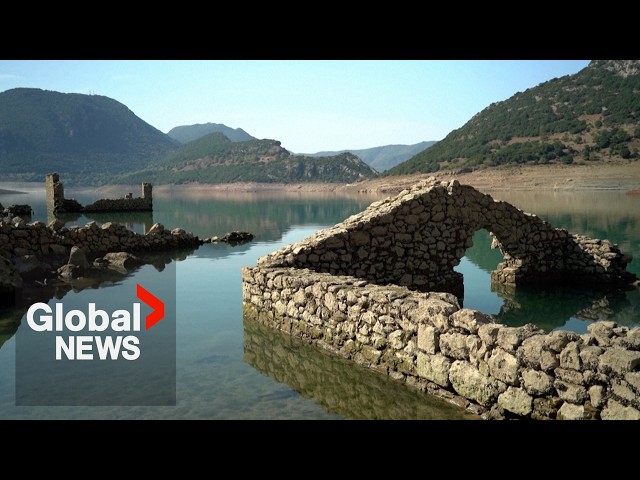 ⁣Sunken village of Kallio emerges in Greece as drought dries up lake