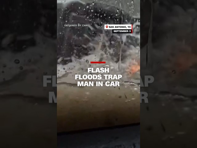 ⁣Flash floods trap man in car