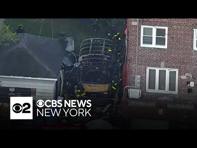 ⁣School bus catches fire between Brooklyn buildings