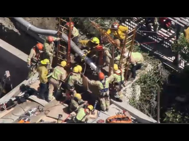 ⁣Live: Rescue efforts continue to save a worker trapped in a trench in Los Feliz.