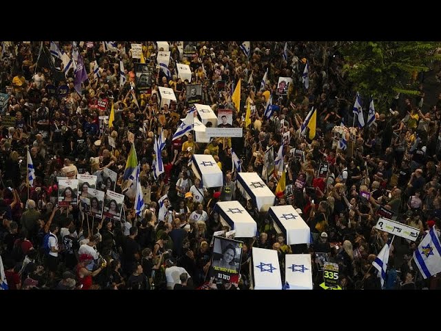 ⁣Protesters march in Tel Aviv with makeshift coffins to demand release of Gaza hostages