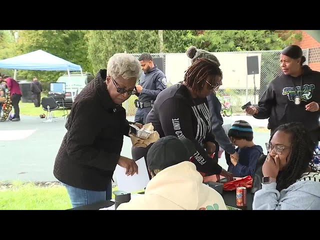 ⁣DPD, residents encourage safe gun storage at community event giving away free gun locks