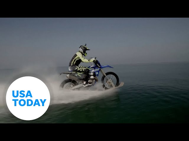 ⁣Watch: Biker rides across open water | USA TODAY