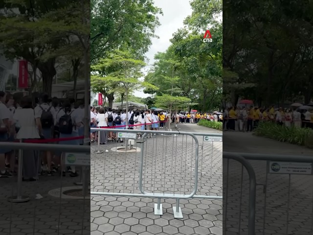 ⁣Long queues seen at Singapore's National Stadium ahead of papal mass