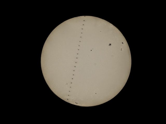 ⁣Half-second image: China Space Station flashes past the sun