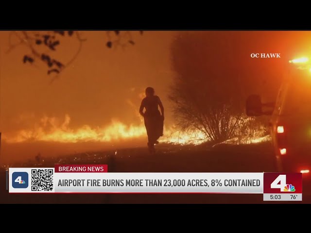 ⁣Firefighter rescues woman surrounded by Airport Fire