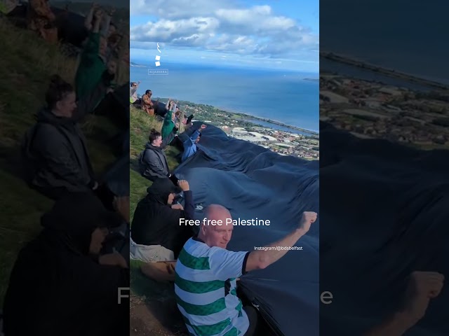 ⁣Activists unfurl giant Palestinian flag at top of Northern Ireland hill | AJ #shorts