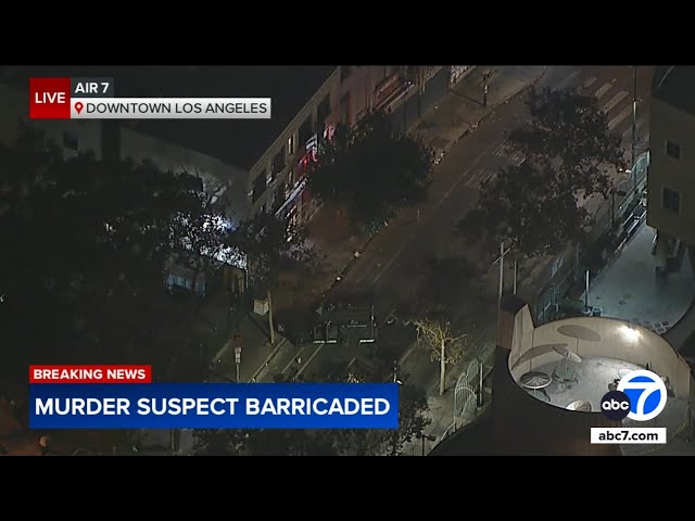 ⁣Murder suspect barricaded in downtown LA apartment building