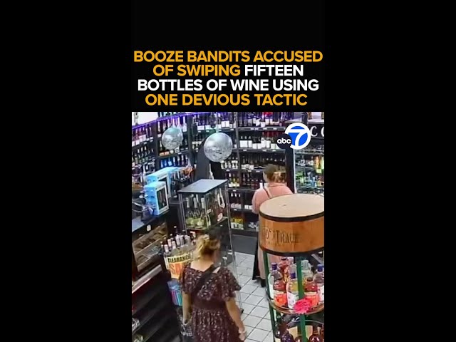 ⁣Women steal wine with devious dress