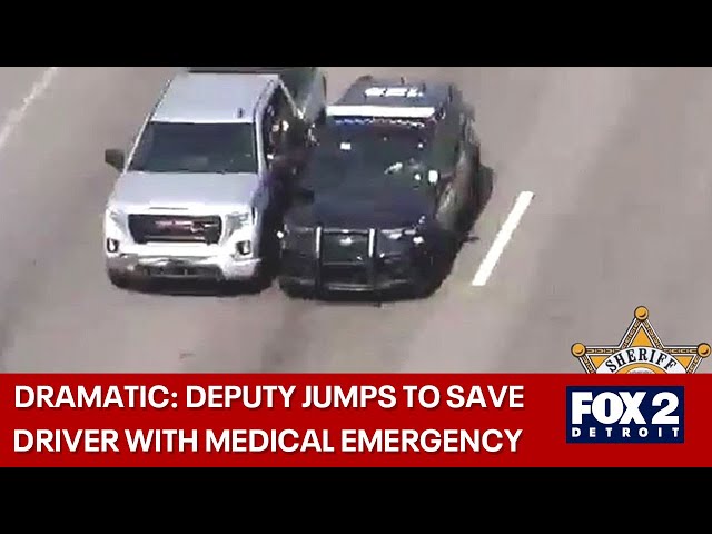 ⁣Video shows dramatic rescue on Gratiot with deputy jumping into truck