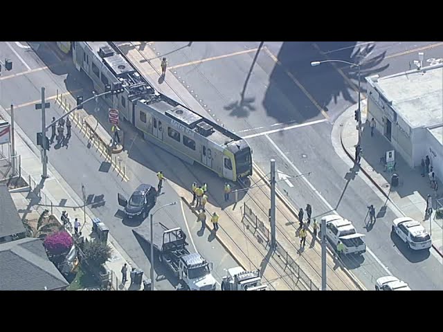 ⁣Metro train collides with car on street in East LA, derails; 1 hurt