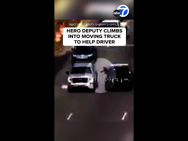 ⁣Hero deputy climbs into moving truck to help driver