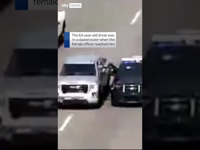 ⁣Police climb through window to rescue driver