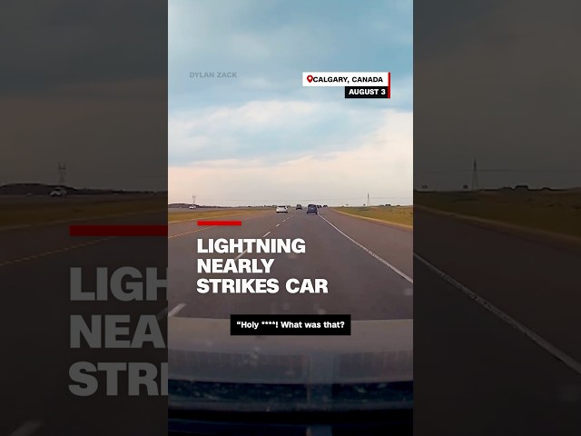 ⁣Lightning nearly strikes car