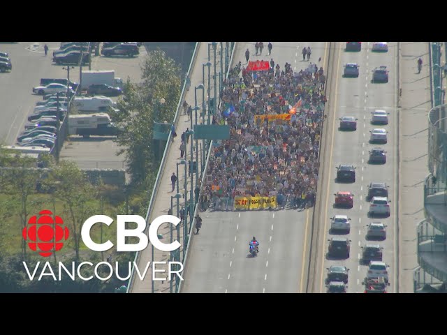 Climate protesters march through downtown Vancouver