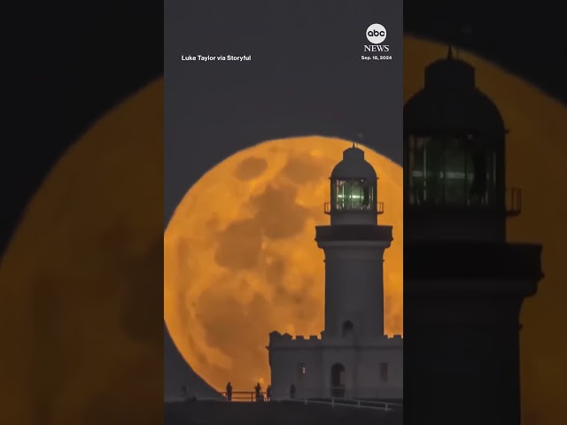 ⁣Supermoon rises behind historic Australian lighthouse