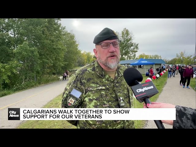 ⁣Calgarians walk together to show support for veterans