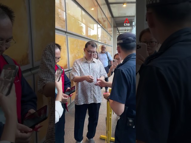 ⁣Members of the public queue for High Court tickets ahead of S Iswaran’s trial