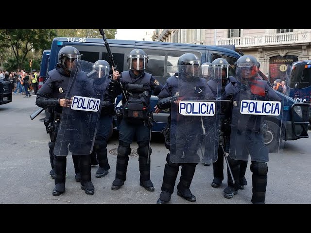 ⁣Protesters clash with police at Barcelona real estate fair