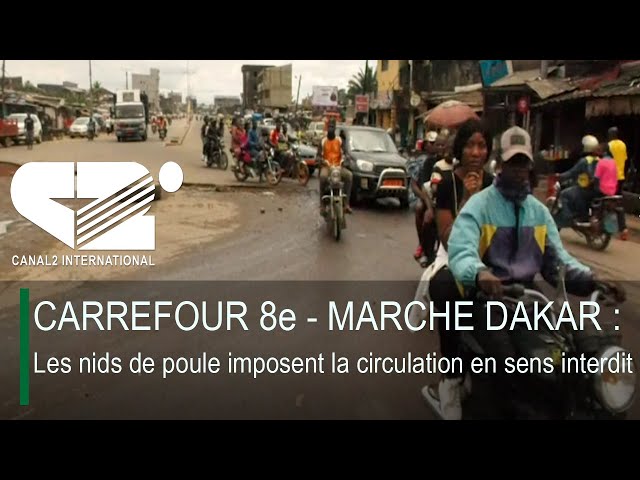 ⁣CARREFOUR 8e - MARCHE DAKAR : Les nids de poule imposent la circulation en sens interdit