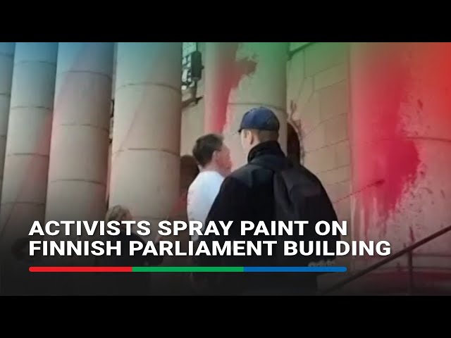 ⁣Activists spray paint on Finnish parliament building | ABS-CBN News