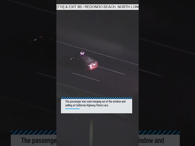 ⁣Passenger hangs out of vehicle during pursuit in Long Beach